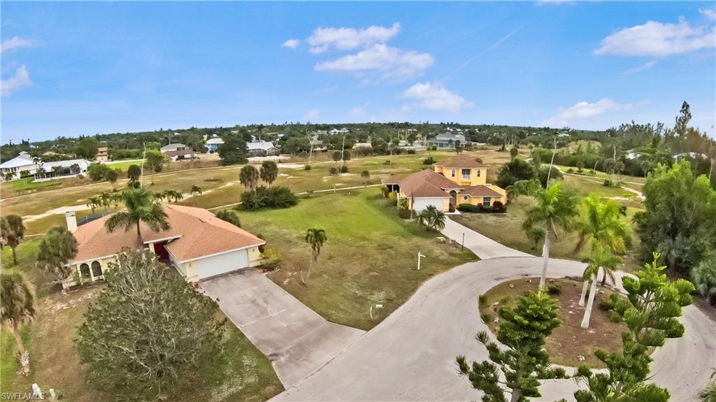 Nestled at the end of a quiet cul-de-sac on Tamarac Drive, this .35-acre homesite in the Alden Pines neighborhood of Pineland offers exceptional privacy on a peaceful street with no thru traffic. The lot features golf course frontage with serene natural views, and although the course went defunct following Hurricane Ian, it is currently in the process of being purchased by a new party committed to revitalizing and reopening it—creating exciting future upside for property owners. The property has access to public water, electricity, and high-speed internet, with a septic system required for any future home. Per the seller, the lot has no flooding history. A voluntary HOA is available with no mandatory fees, and property taxes are county-only with no city taxes. This prime location is walking distance to Tarpon Lodge restaurant and hotel, Pineland Marina, local shops, Island Grill Eats & Tiki Hut, Tropic Star and Island Girl ferry services, and the Randell Research Center. The surrounding area is very golf-cart friendly, allowing you to cart to Pineland Marina for sunset watching and enjoy abundant nature and wildlife throughout the neighborhood. Home plans have already been prepared specifically for this site and can be provided to interested buyers upon request, offering a valuable head start on building your ideal Pine Island home. Located in the desirable Pineland area of Bokeelia, this property presents an excellent opportunity to secure a buildable lot in a quiet, established community with long-term potential.