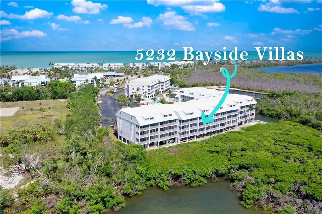Start each day surrounded by the sights and sounds of island life from this second-floor, one-bedroom, two-bath furnished condo overlooking Pine Island Sound. Sunlight pours through wide sliders that open to a private lanai, where gentle breezes carry the scent of salt air and the call of seabirds. Watch dolphins play and boats drift by—a constant reminder you’re living on island time. Located within the southern enclave of South Seas Resort blends comfort and convenience with an easygoing Captiva lifestyle. Tile flooring throughout creates a cool, carefree atmosphere, while the kitchen features stainless-steel appliances and open sightlines to the bay. The guest bath provides added flexibility for visitors, and the bedroom offers a peaceful retreat after a day in the sun.  Owners participating in the Resort Rental Program and Club Captiva enjoy access to full resort amenities, including Sunset Beach, pools, lounges, umbrellas, and chairs for relaxed days along the Gulf—all just a short stroll away. A ground-level storage locker in the 5000 building is perfect for keeping beach gear, SUP, or fishing gear!  From this ideal location, it’s easy to enjoy all that Captiva has to offer—bike along palm-lined roads, kayaking through mangroves, or watching the sunset over the Gulf. Explore the island by golf cart, or unwind with cocktails as the sun dips below the horizon. The Bayside Villas community also features a waterfront pool, spa, and under-building parking. 5232 Bayside Villas offers a front-row seat to Captiva’s natural beauty and a laid-back rhythm that makes every day feel like vacation.