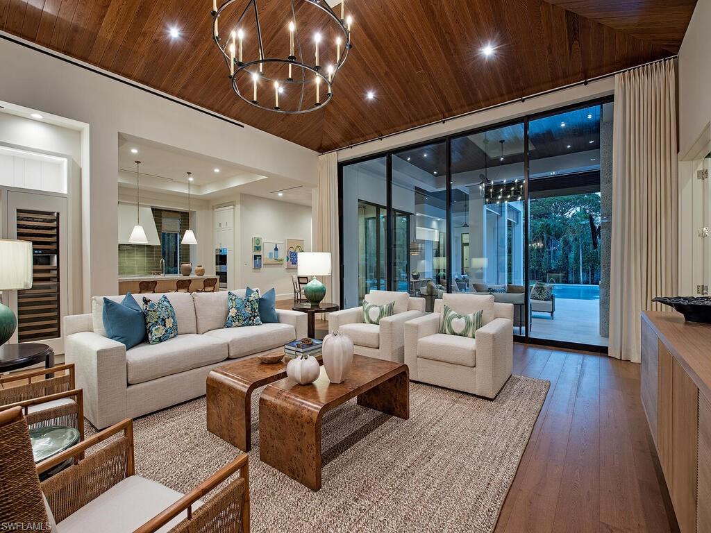Spectacular new construction single story home located on an estate sized lot in Coquina Sands just 2 blocks to the Gulf of Mexico. Designed by Stofft Cooney Architects and built by Equinox Construction Group this home offers five bedrooms all ensuite and a club room on one level. Exquisite interior finishes selected by Ficarra Design Associates include a chefs inspired kitchen with beautiful custom cabinetry, large island with marble countertop, high end appliance package. Other features include European Oak floors, marble and tile bath. Great room and lanai offers a seamless transition to the amazing outdoor entertaining area that has a summer kitchen, fire place, large pool and spa. Exterior highlights include roll down screens and shutters, 3 car garage with circular paver drive. Quality finishes through out make this home a must see.