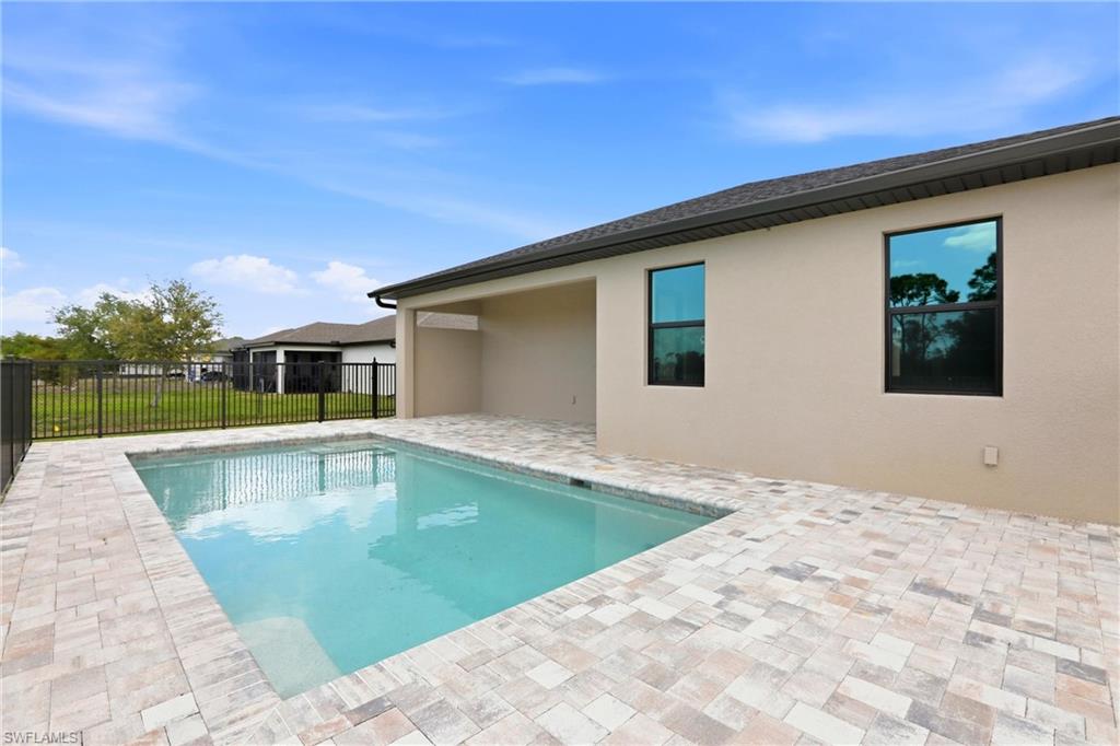 New Construction 3/2 Pool Home on Canal, $2,699, NW Cape Coral. The Only Thing Used Here Is the Word "New"

BRAND NEW 3 bed, 2 bath, 2-car garage POOL home for rent on a canal in NW Cape Coral. 1,515 sq ft, fenced yard, pool care included, pets welcome with a one-time fee and no monthly pet rent, and priced at $2,699. Available now.

New construction done right in the fastest-growing corner of Cape Coral, and the lowest-priced canal-front pool rental in its class. Not builder-grade, not cookie-cutter. The paver driveway sets the tone before you walk through the door: clean, polished, no wasted effort.

Inside, you get true brand-new-home condition. Crisp finishes, untouched surfaces, zero weird layout compromises from a previous owner. The open living space is bright and functional, custom accent walls add character, recessed lighting keeps things sleek, and oversized modern fans bring comfort without looking like an afterthought.

The kitchen is the centerpiece, not a footnote. High-end finishes, solid waterfall countertops, and a peninsula island with bar seating that makes the space genuinely usable for entertaining.

Three spacious bedrooms. Two sharp bathrooms with lighted anti-fog mirrors, so mornings start without wiping down steam like a chore.

Then there's the pool: private pool, paver deck, and pool care included, all with a canal backdrop that makes the backyard feel more like a private waterfront retreat than a standard yard. Add the fully fenced yard and you get privacy, pet space, and views most rentals can't touch.

No city water bill. Private well with professional monthly service included: salt, cleaning, everything. $65/month billed with rent, zero tenant responsibility.

Epoxy garage flooring and washer/dryer hookups ready to go (tenant provides machines). Minutes from Matlacha, parks, golf, and the NW Cape's newest dining and shopping.

Pets are welcome with approval. A one-time pet fee applies, with a minimum fee of $350 per pet, plus a $25 pet acceptance fee per pet. No monthly pet rent. Breed restrictions apply.

Lease Terms: Available now. 12-month lease. Security deposit of $2,699 and application fee of $75 per adult apply. $45/month Resident Benefit Package fee. $65/month well service fee. Pool care is included. Tenant provides washer and dryer.