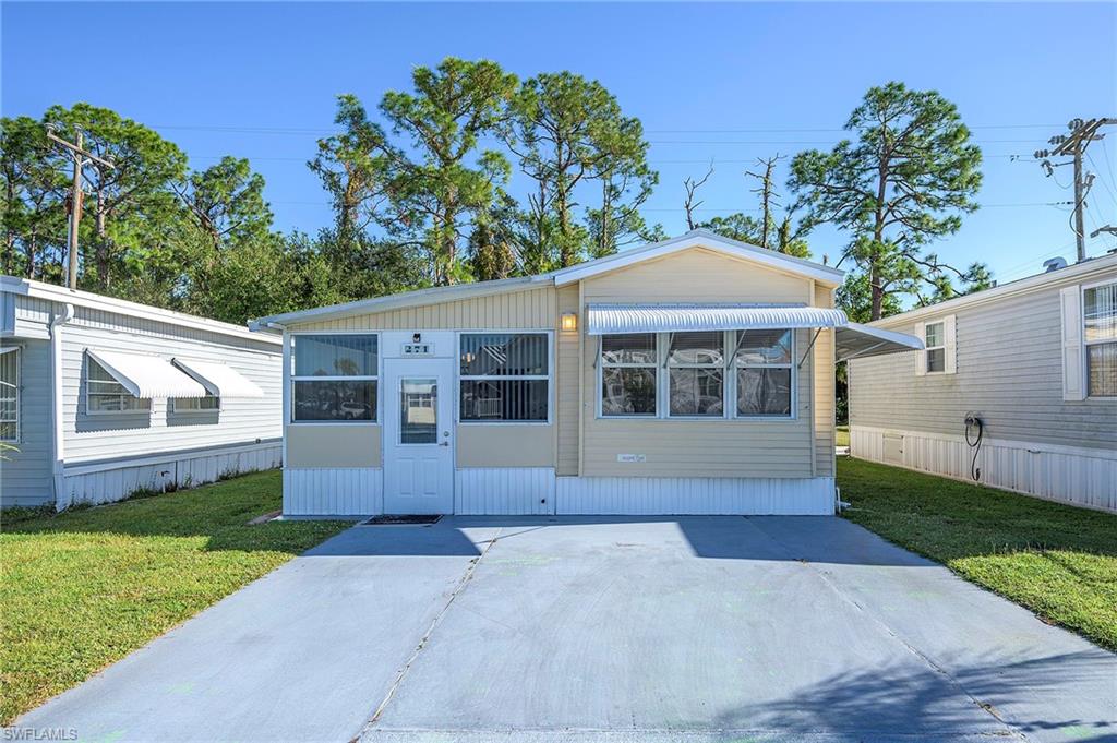 Here's another darling bungalow in the LAND OWNED community of Fountain View!!! You will love all the amenities of this 55+ community in North Fort Myers. This home offers two bedrooms with closets. In addition to the primary bedroom, the upper level has the kitchen, dining area, sitting area and a full bath. The kitchen has ample cabinet space and everything you need to start living the Florida lifestyle. The lower level has a family room with plenty of sitting space for entertaining and watching tv. The second bedroom is also on the lower level along with the stackable washer & dryer. There are lots of windows in the home, making it feel very bright and open. There is room to park two vehicles in the front of the home and a very private backyard area. You can sit on the patio where you are sure to see lots of Florida wildlife or just soak up the sun all day long. This home won't last long.