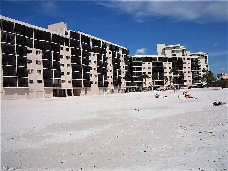 Fabulous DIRECT GULF FRONT corner Penthouse overlooks the Gulf & our famous white sand beach.This MEGA-income producing, 4BR/3B condo has breathtaking 180 degree views from two balconies.What a rarity that is! Over $190K in renovations and was remodeled from the studs out, including two newer zoned air-conditioners; new hurricane glass in windows and sliders...the list of upgrades just goes on and on. Spacious floor plan has approx. 2150 total sq.ft of beachfront elegance.The kitchen,with Gulf views, is open to the dining & living room with unique custom hardwood cabinetry, granite counter tops with tumbled stone and stainless steel appliances. Attention to detail is obvious and unit is immaculate. Yes, that's a (grandfathered) built-in Jenn-Air grill on the lanai! INCLUDES  2-CAR ENCLOSED GARAGE (prime location & with bathroom!); another 1-CAR ENCLOSED GARAGE; 2-CAR SIZE BEACH FRONT ENCLOSED CABANA/STORAGE/MAN CAVE-SHE SHACK !!!!