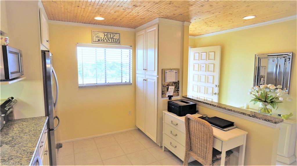 Stunning sunset views from this beautifully upgraded 4th floor Town and River condo. This spacious 2/2 PLUS den features a fully remodeled kitchen with granite countertops, KitchenAid appliances, and pantry. Kitchen opens up into dining and living room for open concept living. Den at the end of living room has a custom built in wine bar with cabinets, wine cooler, and fridge, and panoramic views of the sunset over the canal. Master suite has sunset views from bedroom and a fully upgraded bathroom with granite vanity top, frame-less glass shower enclosure and large walk-in closet with shelving. Guest bedroom with large closet, and guest bath with tub are off of entry hallway, in addition to walk-in laundry room with additional storage shelving. This beautifully maintained complex offers many amenities, including a pool, multi-room clubhouse, fitness room, waterfront terrace, tennis courts, billiards, tool room, canoe/kayak storage, gardens and boat docks! 1 assigned covered carport spot is included with adjacent storage closet. This central location is within minutes of downtown, beaches, Cape Coral, restaurants, shopping etc. Take advantage of all Southwest Florida has to offer!