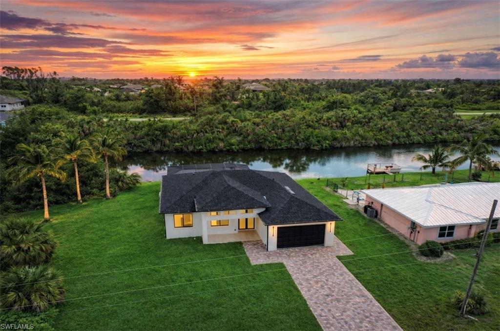 An exceptional waterfront residence where elegance, comfort, and lifestyle unite. 13630 AllamandaCir. Port Charlotte FL.



Welcome to this stunning brand-new 2025 home located in the highly desirable SW Port Charlotte, where year-round sunshine, glowing sunsets, and tranquil surroundings define everyday living.



Thoughtfully positioned just minutes from prestigious golf courses, this residence offers an elevated lifestyle for those who appreciate refinement and nature in perfect harmony. Its navigable canal provides direct access for boating, fishing, or leisurely cruises—bringing the true Florida waterfront experience right to your backyard.



The home features 3 generously sized bedrooms, and 3 beautifully designed full bathrooms, all showcasing modern finishes, elegant closets, and timeless design.

The kitchen is a true masterpiece—a sophisticated and functional space with high-end finishes, exceptional lighting, and a striking modern pantry with custom shelving and drawers, ideal for both daily living and entertaining.



Every detail has been carefully curated, from the perfectly balanced lighting that enhances each space to the seamless indoor-outdoor flow. Step outside to your private oasis featuring a resort-style pool overlooking the canal, an inviting outdoor grilling area, and a dedicated refrigerator for cocktails and beverages, designed for unforgettable gatherings. The property also includes two garages, offering ample space and everyday convenience.



This home is especially ideal for buyers relocating from colder states who desire a luxurious second home in a warm, vibrant setting. Florida stands as the ultimate destination, and SW Port Charlotte offers an exceptional advantage with lower taxes, a relaxed yet refined atmosphere, and a lifestyle that is both sophisticated and effortlessly enjoyable.



Renowned for its peace, natural beauty, and growing vibrancy, Port Charlotte continues to evolve with exciting new developments, including the renowned Sunseeker Resort, a premier waterfront destination that has elevated the area’s appeal and lifestyle.



?? More than a home—it is an invitation to live beautifully.