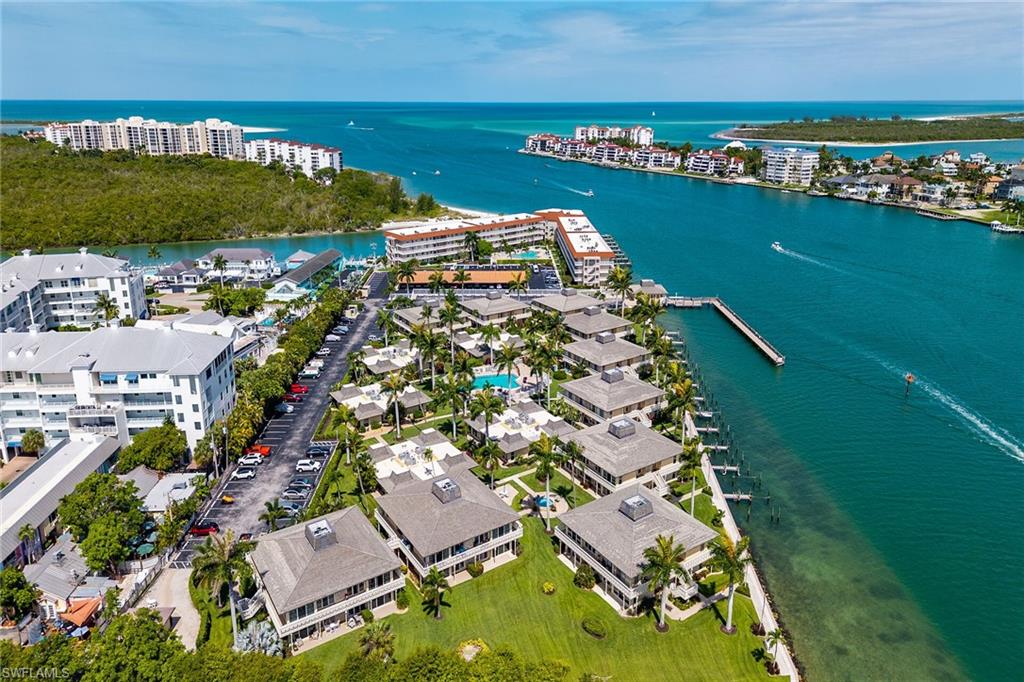 Paradise is calling! Discover the perfect island retreat in this beautifully updated first-floor 1-bedroom, 1-bathroom condo, located just steps from the scenic Marco River. Designed for comfortable coastal living, the kitchen features stainless-steel appliances, granite countertops, and ample cabinet space. Additional upgrades include an updated bathroom, hurricane-impact windows, doors, and sliders, along with tile flooring throughout for easy maintenance and a clean, timeless look. Step outside to your private open patio and embrace the relaxed Florida lifestyle, surrounded by lush tropical landscaping and a charming garden-style setting. Convenience is everywhere, with parking nearby your front door and the community pool nearby for effortless relaxation. Being sold unfurnished, this condo offers the perfect blank canvas to create your own personalized island getaway. For boating enthusiasts, docks may be available for lease, providing easy access to the water and all that Southwest Florida's boating lifestyle has to offer. Ideally situated near popular restaurants and shopping this exceptional condo places the very best of island living right at your fingertips. Whether you're searching for a seasonal getaway, investment opportunity, or full-time residence, this inviting condo offers the perfect blend of comfort, convenience, and island charm.