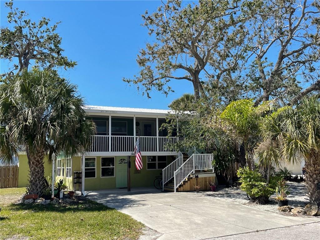 INVESTOR ALERT! Featuring a completely remodeled duplex with all new windows, new kitchens and new appliances-Upper unit features true oak flooring and tile-two bedrooms /two baths- Kitchen with new quartz
countertops, under counter lighting-Side door  to new deck & staircase-All updates approx within  2+ years Entrance has a large screened lanai, canvassed with oak trees for shade- Central air only 2+ years old-Features temperature controlled attic fan adds to efficiency- Duplex has a durable concrete tile roof-Hot water heater only 2+ years old- Lower two bedroom, two bath has all new appliances, tile floors and plaster walls- Utility room with washer/dryer for common use- Exterior a recently recoated gorgeous large 12x28 salt water pool awaits for enjoyment along with a remote power awning to shade the patio-A fenced yard for privacy, a new 7x12 storage shed on slab- DUPLEX ZONED TFC2 FOR WEEKLY RENTALS-  PLEASE NOTE :THERE IS A 24 HOUR ACTIVE SECURITY CAMERA IN PLACE FOR SECURITY- HERE IS A TRUE GEM WHERE PRIVACY AWAITS PLUS ONLY A SHORT FIVE MINUTE WALK TO THE WHITE SANDY BEACH!