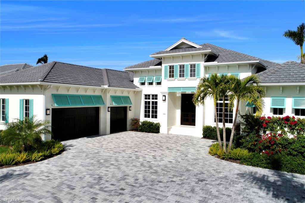 H.12527 A newly completed residence that pairs timeless, elegant design with the highest quality construction.  This stunning home is located in one of the very best Moorings locations, West of Crayton Road and a short walking distance to the private Moorings Beach Park.  Built by Dillman Construction, one of Naples premier luxury builders, this great home offers the perfect balance of casual and elegant living.  Wide plank European oak floors, extensive moldings, and custom woodwork combined with an open floor plan w/ separate dining area and den provide great entertaining possibilities and set this home apart. Gorgeous outdoor entertaining area, w/ 40-foot lap pool & spa, outdoor kitchen, and open view gas fireplace. Inside, the spacious kitchen features custom cabinetry, Sub Zero and Wolf appliances, hidden walk-in pantry, and large island.  Tranquil master suite w/ elegant marble finishes and custom fittings in the spa-like bathroom.  A further 3 bedrooms all with en-suite bathrooms round out the floor plan.  Beautifully landscaped and private .37 acre spacious grounds provide lovely views. The perfect combination of style, exquisite finishes and optimum location.