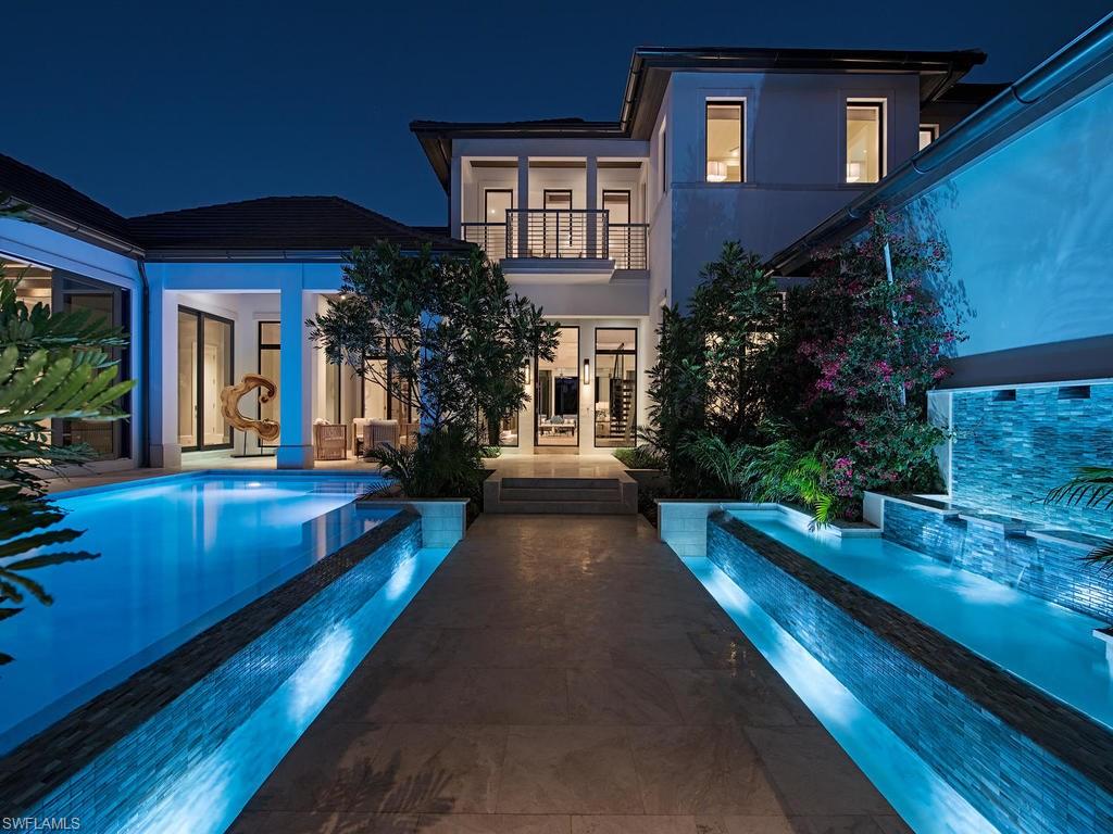 Fresh. Bold. Elegant. Thoughtfully drawn by Stofft Cooney Architects, assembled by the craftsmen at Waterside Builders Inc. and beautifully appointed and furnished by Ficarra Design. Closer to the beach than any other waterfront property in Aqualane Shores. There is no equal in the marketplace to the lifestyle this property offers. Entering the property one is greeted by cascading pools, warm southern sunshine and lush landscaping creating the feeling of an oasis; the first of two outdoor living areas. Walk into the home and the quality is immediately apparent. Legno Bastone wood floors with natural stone inserts, an incredible Allikristé designed kitchen with galley sink, twin dishwashers, top of the line Miele, Wolf and SubZero appliances, a hidden pantry, and a custom see-thru glass wine room. Full Control 4 automation; lights, sound, security, pool, and climate. Offering 2 true master suites, a guest casita, media room, two laundry rooms, and parking for 4 cars plus a golf cart. Through the 10' sliding glass doors at the rear of the home discover another inviting outdoor living area, kitchen/dining area, and a fire pit gathering space to enjoy the long water views of Aqua Cove.