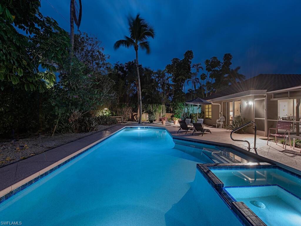 AN EXCEPTIONAL OPPORTUNITY WITH A GENEROUS OVERSIZED LOT OVERLOOKING THE 10TH HOLE OF THE NEW NAPLES BEACH CLUB COURSE awaits you in one of the most coveted areas in Naples, Old Naples! Within very close proximity to the highly anticipated FOUR SEASONS AND THE NAPLES BEACH CLUB as well as the glistening Gulf of Mexico this location resides within the upcoming PINNACLE of town! This darling residence is livable and is a mere 9 RESIDENCES FROM THE BEACH boasting unsurpassed sunsets, and overlooks the upcoming completely reimagined Naples Beach Club Golf Course. This generous, oversized parcel, with southern exposure also allows you to create a residence with your own personal team with phenomenal award winning architects, builders, interior designers, and landscape architects to partake in assisting you to create your very personalized custom residence. The perimeter of the residence/parcel boasts lush mature landscaping creating an ambiance of serene privacy encapsulating you with a true Old Florida ambiance! You are centrally located west of US41 nestled between the Ritz Carlton/ Shops at Mercato and the Iconic 5th Avenue S / 3rd Street S. This exceptional opportunity allows your completion if choosing to build simultaneously within the estimated completion time frame of the Naples Beach Club! Also a great income producing very livable residence!!!!