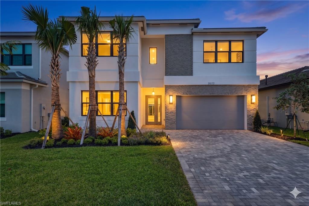 VERY RARE opportunity to own a virtually brand-new 2-story Cascade residence in RiverCreek with incredible premium upgrades unlike any other home in the community! The Cascade is RiverCreek's most expansive floor plan with 4,435 sq ft under air, featuring 5 bedrooms plus den, 7 baths, formal living and dining, a family room, loft, and a 2-car garage with smart thermal design. With over $175,000 in curated upgrades, this home delivers modern luxury without the wait.  This 2-story masterpiece boasts light European-oak-engineered hardwood flooring throughout and a versatile layout.  The 1st-floor ensuite bedroom is ideal for parents, guests, or a private home office. Every detail reflects intentional, high-end selections. The gourmet kitchen showcases high Level III Modena cabinetry, quartz countertops and full backsplash throughout the kitchen, a GE gas cooktop, GE oven/microwave combo, GE under-cabinet lighting, and a custom built-in pantry cabinet. The dramatic 2-story entry with 20 ft ceilings is anchored by a Weathered Oak stair rail with metal balusters.
The primary suite offers exceptional privacy with separate his-and-hers master ensuites, each featuring a soaking tub, upgraded shower flooring, and floor-to-ceiling tile. All bedrooms include full ensuite bathrooms. The spacious first-floor guest bedroom provides excellent flexibility for multi-generational living or a private home office. A full cabana bath off the family room offers direct access to the lanai, ideal for a future pool or outdoor entertaining area. Extensive lighting and technology upgrades include a premium recessed lighting package, HDMI pre-wires in the family room and loft, modern chandeliers, island pendants, and contemporary fans throughout. Built for long-term durability: all-concrete block construction on both floors, reinforced steel rebar, concrete tile roof, Miami-Dade impact windows and doors with laminated ES glass, 2-zone HVAC, insulated garage doors, seamless gutters on all sides, epoxy-coated garage floor, extended paver driveway, and impact glass entry door. Enjoy a drink on the lanai enjoying spectacular sunset views. The home includes the remainder of the builder’s 1-year and a 10-year structural warranty. There is also a professionally designed ***custom pool & spa bid*** ready for execution! The design features a 343 sq. ft. pool, elevated 12" spa, sun shelf with bubbler, swim-out bench, Ivory travertine deck, Silver Pearl plaster, Pentair smart automation, variable-speed pump, salt system, a bronze screen enclosure (approx. $103,000 not included in price). AMENITIES: RiverCreek boasts resort-style amenities: A clubhouse, fitness center, indoor sports complex, tennis, pickleball, and a community pool. This home is located on a quiet cul-de-sac at the rear of the community providing privacy, no through-traffic - in a peaceful setting. A rare opportunity to own a luxury-finished Cascade at a high elevation in one of Estero's most desirable new communities.