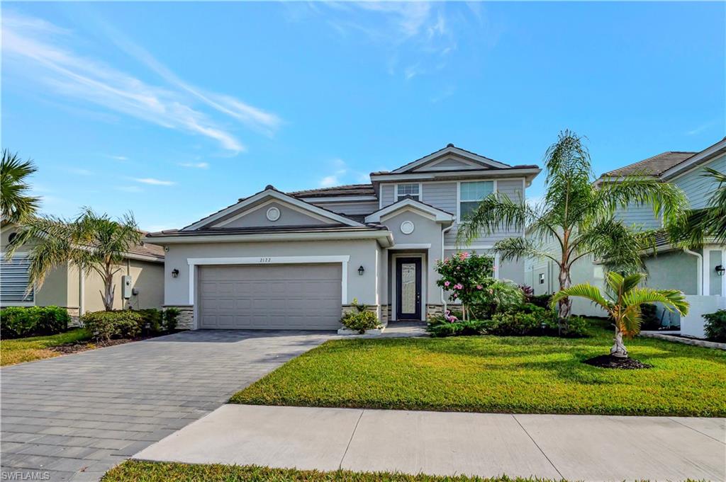 Nestled in a serene and picturesque setting, this beautifully maintained 2022-built home offers 4 bedrooms plus a loft, 3 bathrooms, and approximately 2,529 square feet of thoughtfully designed living space. An inviting entryway welcomes you into a bright, open floor plan featuring a spacious dining area and an abundance of natural light throughout. The gourmet kitchen is equipped with modern appliances, granite countertops, ample cabinetry, and stylish lighting, making it perfect for both everyday living and entertaining.

The open-concept living area seamlessly extends to a covered lanai overlooking tranquil water views, creating the ideal space to relax or host family and friends. Upstairs, a versatile bonus room provides additional living space for a media room, game room, or home office.

The spacious primary suite offers a private retreat with an en-suite bathroom and an oversized walk-in closet. Additional highlights include lush tropical landscaping, excellent curb appeal, and a two-car garage.

Located in the highly sought-after, gated community of The Ranch at Orange Blossom, residents enjoy an array of resort-style amenities and a convenient location close to shopping, dining, schools, and more. Don't miss this exceptional opportunity to own a beautiful home in one of the Naples most desirable communities!