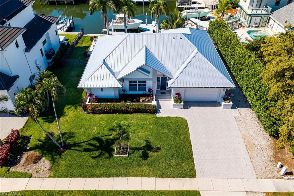 Welcome to your dream waterfront retreat! This beautifully remodeled 3-bedroom, 2-bathroom home sits on an extra-wide lot and offers the perfect blend of comfort, style, and coastal living.
Recent upgrades include a new metal roof, impact-resistant windows and doors, motorized roll-down screens, a newly paved pool deck, resurfaced pool, new pool heater, newer A/C system, and updated appliances -- with even more improvements throughout the home.
Enjoy relaxing by the pool or heading out for a quick boat ride to the Gulf through scenic Robert's Bay. Conveniently located near parks, schools, shopping, and dining, this home offers both tranquility and accessibility.
This waterfront gem truly has it all -- schedule your private showing today and experience it for yourself!