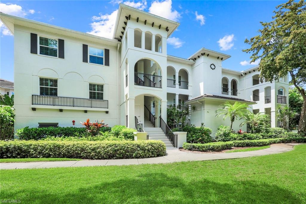 This bright and spacious 2-bedroom + flex room condo with soaring ceilings has a beautiful lake view featuring a picturesque water display. Filled with natural light, this inviting residence offers an open floor plan ideal for comfortable living and entertaining. The primary suite features a king-size bed, while the second bedroom is furnished with two twin beds. The flex room provides additional space for a home office, reading room, or guest area. Enjoy resort-style amenities including a private tram to the beach, two private restaurants, tennis and pickleball courts, a fitness center, swimming pool, and more! Enjoy the Pelican Bay lifestyle that makes Naples a premier destination.