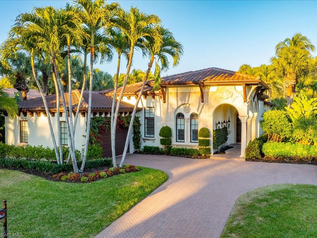 Nestled within the prestigious gates of Grey Oaks Country Club, this exquisitely renovated residence offers a rare blend of refined elegance, architectural drama, and effortless country club living.
Thoughtfully designed with 3 bedrooms plus a private den, 3 full baths, and a powder bath, the home draws you in with striking ceiling detail, European White Oak wood floors and sophisticated finishes throughout the main living areas. The modern gourmet kitchen is a true centerpiece, showcasing premium Wolf, Bosch, and Sub-Zero appliances, leathered Taj Mahal quartzite countertops, dual refrigerator drawers, and an adjacent butler’s pantry with bar — perfect for seamless entertaining.    The open floor plan showcases a stunning floor-to-ceiling limestone-tiled gas fireplace and tv wall with art niche which creates a cozy, yet stylish living room. A dramatic cocktail room crowned by a statement chandelier creates an unforgettable first impression and sets the tone for intimate gatherings and elegant evenings at home.  
Disappearing doors open to a beautifully screened lanai, where indoor and outdoor living blend effortlessly. The heated pool and spa are framed by lush landscaping and tranquil waterfalls cascading into a private pond, creating a setting reminiscent of a secluded Hawaiian retreat. A dedicated outdoor dining area completes the experience — ideal for relaxed entertaining year-round.  For peace of mind, the roof was replaced in 2020 and the home is fully equipped with AstroGuard hurricane protection for all openings.  Living in Grey Oaks means more than owning a home — it means stepping into one of Naples’ most coveted country club lifestyles, with world-class golf at 3 championship golf courses, tennis, pickleball, fitness, fine dining, casual dining, two clubhouses, resort-style pool and a 30,000 square foot Wellness Center plus an active social calendar just moments from your door.
This is luxury living, elevated.
