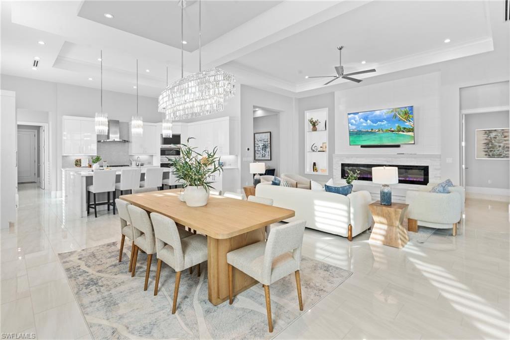 This stunning DIVCO-built residence, set along the tranquil lakefront, offers 3,227 square feet of luxury designed for effortless entertaining. With soaring 10’–13’ ceilings and chic designer finishes, the open living spaces flow seamlessly into a chef’s kitchen featuring Wolf appliances, elegant marble countertops, and a waterfall-edge island. A convenient butler’s pantry enhances functionality and style.

A wall of 10-foot pocketing sliders opens to an expansive screened lanai, complete with a fully outfitted outdoor kitchen and a cozy living area with a gas fireplace. Enjoy the serene saltwater pool and spa overlooking the lake, perfect for relaxation.

This thoughtfully designed home includes three en-suite bedrooms, five bathrooms, and a versatile den that can serve as a home office or guest space. The primary suite features a boutique-style walk-in closet and a luxurious en suite bath.

For boating enthusiasts, there’s direct access to a shared dock with water and electricity. Additional features include a three-car garage, whole-home generator, smart home technology, and Storm Smart screens for peace of mind. This home will feature a newly installed, energy efficient HVAC system for optimal heating and cooling, ensuring comfort throughout all seasons. Installation date 5/7/26

Miromar Lakes offers a true resort lifestyle with full-service concierge services, ensuring every detail is effortlessly managed. This lakefront retreat is perfect for those who seek exceptional living.