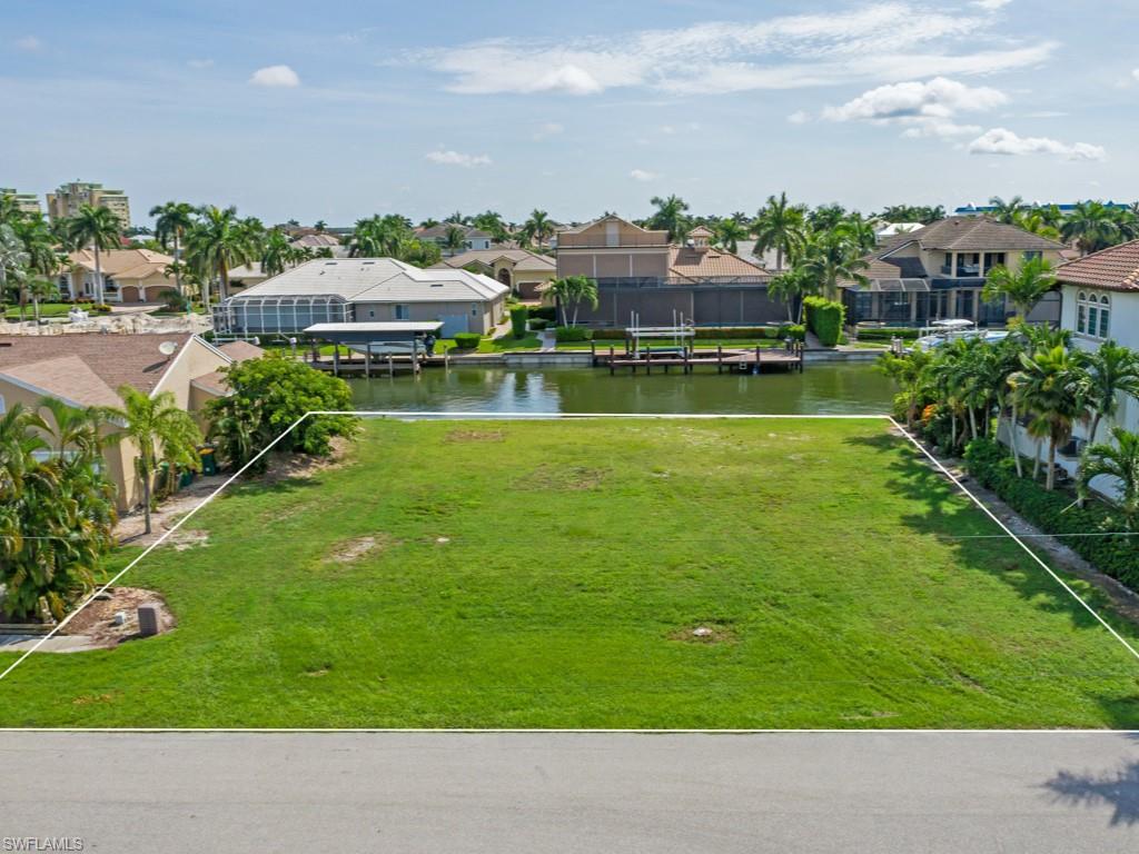 Magnificent water direct lot (no bridges by boat) located in one of the most beautiful and highly-desired neighborhoods at Marco Island!  This generous parcel has 100’ of seawall, plenty of space for a 3-car garage, large pool & pool deck and stately future residence.  Offering super fast access to prestigious Collier Bay and beyond to the Gulf of Mexico by boat, this vacant parcel is the perfect place for your tropical dream home.  This outstanding lot in this popular area won’t last long, so hurry!  Close to wonderful restaurants, entertainment and shopping, too!