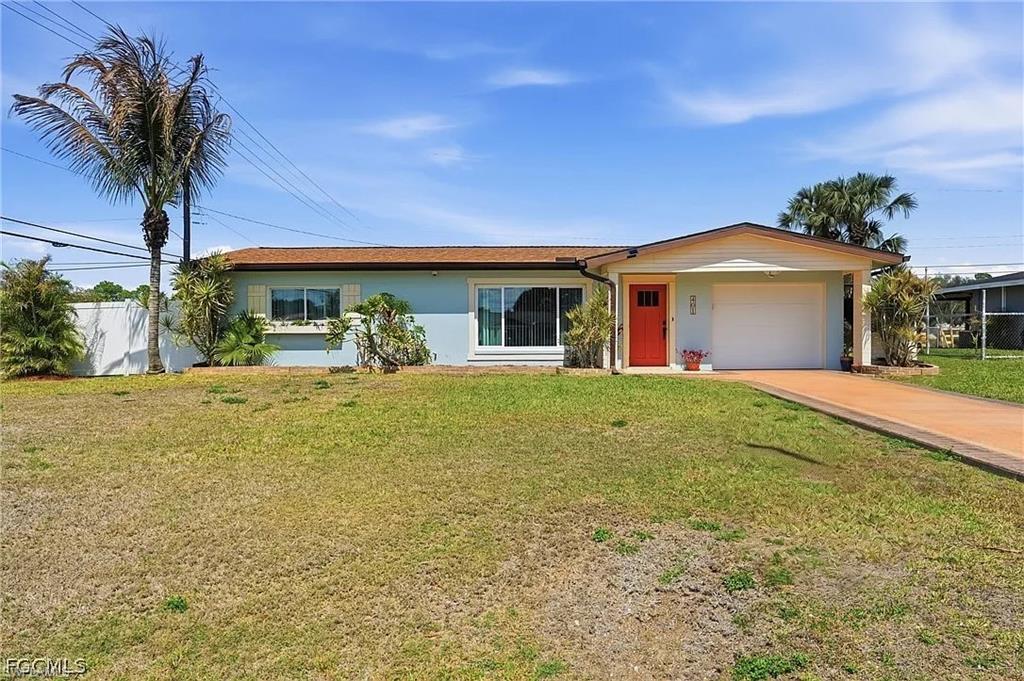 Welcome to this move-in ready single-family home in the heart of Lehigh Acres! This charming residence features a warm and inviting interior with a bright, airy layout that creates a comfortable and welcoming atmosphere from the moment you walk in. The kitchen is equipped with stainless steel appliances and built-in shelving, providing both style and extra storage for everyday convenience.

Situated on a desirable corner lot, the property offers added space and privacy. Step outside to a large fenced-in backyard—perfect for pets, gatherings, or relaxing in your own private outdoor retreat. The yard also features a spacious shed with a ramp and electricity, ideal for a workshop, storage, or hobby space.

With plenty of room to add a pool and endless possibilities for outdoor living and entertainment, this property offers the flexibility to create your ideal Florida lifestyle. Whether you're a first-time buyer, downsizing, or looking for a great investment, this home combines comfort, space, and opportunity in a convenient Lehigh Acres location.