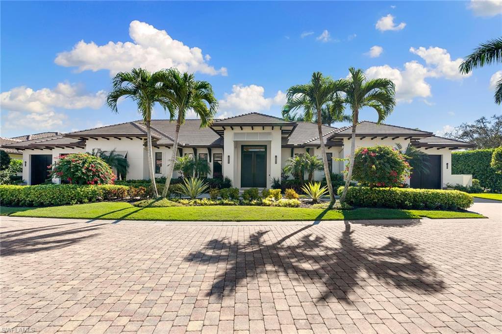 An exceptional value for an unprecedented custom coastal estate home in the double-gated community of Augusta in Pelican Marsh. This masterpiece exudes luxury with soaring 14-foot ceilings, custom millwork and 10-inch plank European oak flooring. With an open concept great room, dining room and innovative kitchen, butler’s pantry with four beverage drawers, two wine fridges and second dishwasher. Floor-to-ceiling windows open to an equally impressive outdoor living space overlooking a lap pool and lush landscape with complete privacy. Retreat to the private primary wing featuring an oversized marble shower for two, generous closet and built-in desk. Along with a large study and powder room, guests will appreciate three spacious bedrooms with en suites in the guest wing with a dedicated garage, second laundry room and access to the pool. No detail has been overlooked in this one-of-a-kind retreat. Control4 smart home automation, surround sound, see-through linear gas fireplace and too many features to list complete this luxurious North Naples oasis. Pelican Marsh offers pickleball, tennis and fitness all included. With A-rated schools, and the hottest restaurants in Naples and the beach within a short drive.