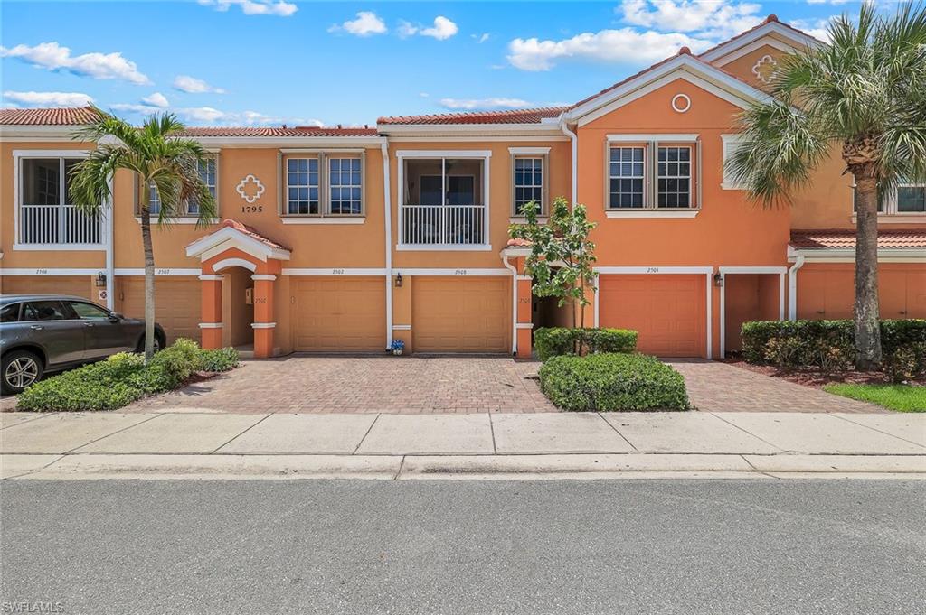 Welcome to Concordia, a sought-after gated community known for its beautifully maintained grounds, exceptional amenities, and convenient location. This move-in ready 1-bedroom plus loft condominium offers a spacious, versatile layout designed to fit today's lifestyle. The bright and airy great room features soaring ceilings and oversized sliding glass doors that open to a private screened lanai, creating the perfect space to relax or entertain. The updated kitchen showcases white cabinetry, granite countertops, a breakfast bar, and newer appliances, while the built-in desk nook provides an ideal workspace for working remotely or staying organized. Upstairs, the generous loft offers endless possibilities as a home office, guest space, media room, or guest retreat, and features a built-in Murphy bed that conveys with the property, providing flexible sleeping accommodations without sacrificing living space. The primary suite includes a walk-in closet and a tastefully remodeled bathroom with a clean, contemporary feel. Additional features include hurricane shutters, a new roof (2025), and a rare oversized tandem garage with room for two vehicles plus extra storage. Located outside the flood zone with no history of flooding, this pet-friendly community has no age restrictions. Low HOA fees cover water, sewer, cable, high-speed internet, trash, exterior maintenance, irrigation, and building insurance, making everyday living easy and affordable. All assessments are paid. Residents enjoy resort-style amenities including a heated infinity-edge pool and spa, fitness center, clubhouse, library, business center, and picturesque walking paths surrounding a scenic 5-acre lake. A private gate offers convenient access to Publix, restaurants, and shopping, while Cape Coral Hospital, the VA Medical Center, downtown Fort Myers, and Punta Gorda Airport are all just a short drive away.
