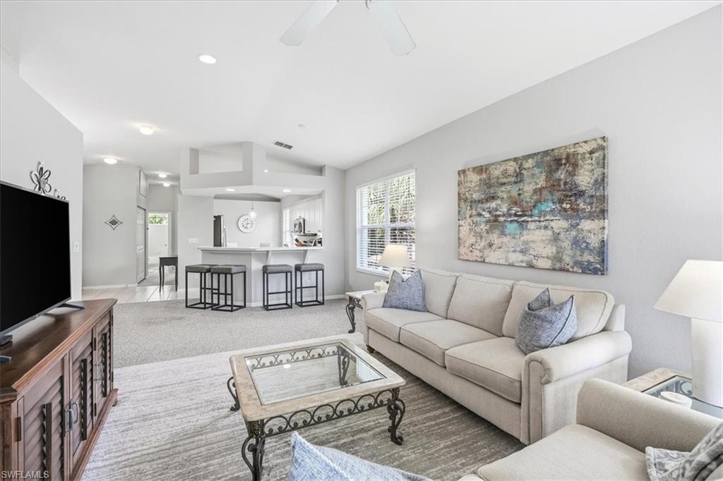 Imagine waking to soft natural light streaming through high ceilings, then sipping coffee on a screened lanai as the sun sets over a shimmering lake. That's everyday life at Unit 201, a beautifully maintained 2-bedroom, 2-bathroom retreat offering 1,292 square feet of bright, open living in one of Estero's most coveted communities. This second-floor gem comes fully turnkey—simply bring your suitcase. The west-facing lanai delivers front-row seats to nightly sunsets, while the primary suite opens directly to the outdoors and features dual sinks plus a walk-in shower. Recent updates include a newer stove, refrigerator, hot water heater, and carpet, adding peace of mind to the easy elegance. In-unit laundry and two assigned parking spots—one covered carport and one reserved space—round out the everyday conveniences. Set within a private, 100% lakefront gated community spanning 162 lush acres, residents enjoy remarkably low density, 44 acres of stocked lakes, cobblestone bridges, tiered fountains, and 26 acres of wildlife preserve. A Bronze Membership to the Commons Club is included, unlocking The Rookery restaurant, social programs, and pickleball. Add bocce, tennis, a lap pool, fitness center, library, fishing pier, and beach club access, and the lifestyle speaks for itself. The location is equally enviable. Coconut Point shopping and dining sits minutes away, with Miromar Outlets, booming Downtown Bonita Springs, Bonita Beach, and Southwest Florida International Airport all within easy reach. Priced to deliver exceptional value, this is Estero living at its finest—move-in ready and waiting.