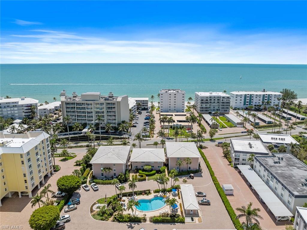 SAND. SEA. SUN. Welcome to your coastal retreat in the desirable Coquina Sands neighborhood. This beautifully renovated and tastefully furnished 2-bedroom, 2-bath condominium offers the perfect blend of comfort and location. Just steps from the sugar-white sands of the Gulf, enjoy breathtaking sunsets, gentle sea breezes, and the relaxed Naples lifestyle. The bright and inviting interior features an open layout, updated kitchen, spacious bedrooms, and a charming enclosed sunroom with Gulf views. Residents enjoy beach access, a community pool, barbecue area, and bike storage. Conveniently located near downtown Naples, Fifth Avenue South, Third Street South, fine dining, shopping, entertainment, and world-class beaches. Seasonal rental opportunity in one of Naples' most sought-after beachfront communities.