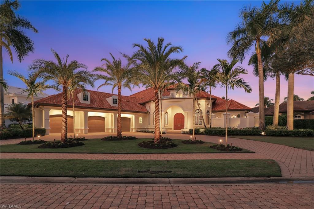 Bay Laurel Estates is a double gated, well sought after location in Pelican Marsh only ten minutes from the beach.  This turn key home is a rare find with a spectacular lake and golf course view from the back of the home.  It is equipped with a full house Generac generator supplying two weeks of power.  There is a double sided fireplace shared by the master bedroom and living room.  The living room has a panoramic view of the pool, lake and golf course and has a full wet bar wine cooler. The home has a gourmet kitchen equipped with a viking six burner gas cooktop, Subzero refrigerator, Bosch dishwasher and double oven.  The Pelican Marsh Community Center includes tennis, pickle ball and exercise room.  The Pelican Marsh Clubhouse and Golf Membership is available separately. Don't miss this must see opportunity, it won't be on the market for long!