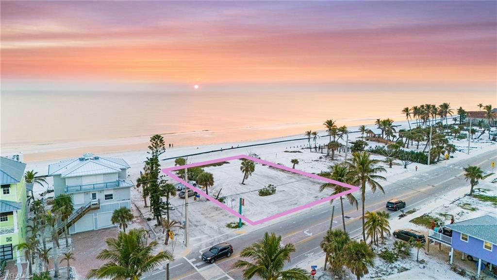 Where Beachfront Bliss Meets Coastal Luxury. This is your chance to own 100 feet of pristine Gulf-front property in the heart of Fort Myers Beach—where the charm of a classic beach town meets the elegance of modern coastal living. Whether you envision a grand seaside estate or a pair of exclusive residences, this premier lot at 4050 Estero Boulevard offers limitless potential. Ideally located, you're just moments from popular waterfront dining at Doc Ford’s, the lively Fort Myers Beach Town Square, and the newly unveiled Margaritaville Hotel. From your own backyard, experience the best of luxury and leisure—soak in breathtaking sunsets, set sail for a day on the water, kayak along tranquil shores, or indulge in the vibrant nightlife. As Fort Myers Beach enters its next great chapter, this rare gulf-front property is your opportunity to be part of the transformation—where relaxed beachside living and upscale coastal elegance seamlessly come together. The future of Fort Myers Beach is here—build your dream home and experience the best of both worlds.