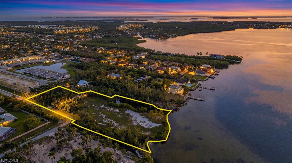 This is the perfect parcel of land offering multiple options. Property is zoned RS-1 and offers 300 ft on the Caloosahatchee river with private gated access. Option 1: Build an exclusive Riverfront Estate sitting on 4.3 acres with a "safe harbor" tidal basin. A "TRUE" boater's paradise waiting for you with direct Caloosahatchee river frontage. Option 2:  Build 8 spectacular homes - all permitting is in place and ready to develop. All the work has been done for you, don't miss this opportunity. This parcel has everything to suit your needs. Enjoy Gulf access and breathtaking views! This won't last long, it's located in the sought after Iona/McGregor corridor and is close to the islands, beaches, shopping and great restaurants. AI-generated conceptual renderings are for illustrative purposes only and do not represent actual property conditions, boundaries, setbacks, or permitted improvements. Buyers should independently verify all development potential, zoning, and regulatory requirements.