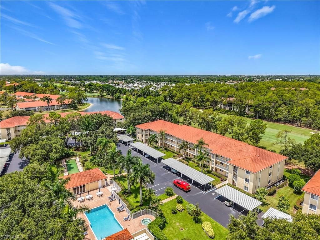 Enjoy breathtaking golf course views from this beautifully renovated 2-bedroom, 2-bath condominium. Located on the second floor, this move-in-ready residence offers a spacious open layout, a screened lanai perfect for relaxing and enjoying the scenery, designated covered parking, and convenient elevator access.The fully furnished unit features a modern kitchen with stainless steel appliances, along with an in-unit washer and dryer for added convenience. Residents can enjoy an active Florida lifestyle with access to community amenities, including swimming, tennis,  clubhouse, resort-style pool, fitness center, restaurant, library, and bocce ball at Amberly Village. Experience a vibrant social atmosphere with year-round activities, including happy hours with live music, golf events, card games, holiday celebrations, dining events, and more. Ideally located just 10-15 minutes from Downtown Naples, 5th Avenue South, Tin City, Naples Pier, and Gulf beaches, with convenient access to shopping, dining, entertainment, and major roadways. Experience the best of Southwest Florida living in this vibrant golf community.