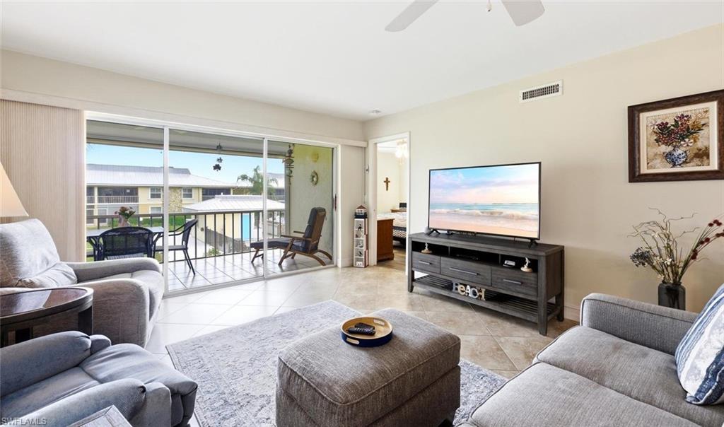 If you are looking for a fully updated condo, in a quiet and friendly 55+ community, you have found it! As soon as you walk through the door you will notice the nicely updated kitchen with granite countertops, newer cabinets (2022 - some with pullouts), stainless steel appliances and decorative plantation shutters. The dining area has a built-in buffet with extra cabinet space. Both bathrooms are completely updated with stylish vanities, fixtures and beautiful tile work. No carpet here. The unit has appealing tile on the diagonal in the main living areas and equally attractive vinyl plank flooring in the bedrooms. The master bedroom has an extra built-in closet, for a total of 3, and the guest bedroom has 2 extra built-in closets. There is also a comfortable murphy bed in the guest bedroom for when friends and family visit. The A/C was replaced in 2025, a new metal roof was put on the building in 2025, and a newer tankless water heater was installed in 2022.The condo is equipped with impact resistant windows, new front storm door and an electric storm shutter on the lanai. Affording you even more storage space, there are pull-down stairs on the lanai which provide access to an overhead storage area and an extra storage unit by the carports. This community is known for its fun social gatherings in the chickee hut and heated pool area. The short drive to downtown Naples and its gorgeous beaches make this home extra special. With a low Condo fee and no anticipated assessments, this is a condo you really don't want to miss seeing.
