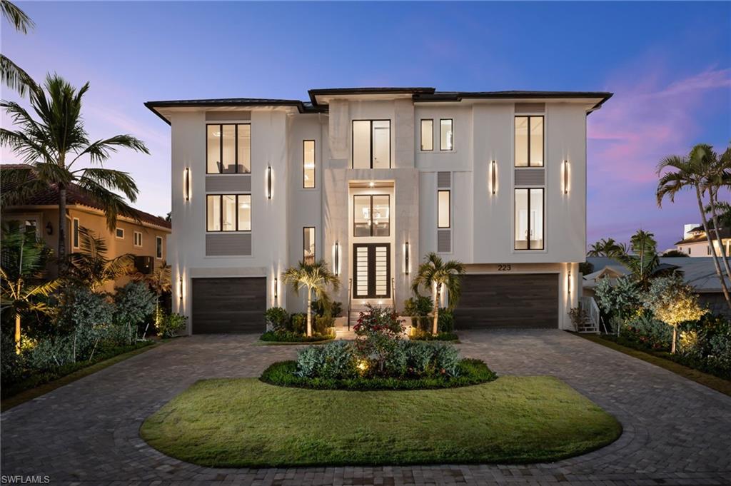 This BRAND NEW waterfront estate has been built to the highest standards of coastal construction. Just a few steps from your own secluded beach access and a short boat ride to the Gulf, this remarkable property provides an unparalleled lifestyle. Live large with almost 6,000 square feet of air-conditioned space, a finished main floor and pool elevated 19 feet above sea level, and spanning nearly 11,000 total square feet. An architectural masterpiece in a league of its own with its impeccable design, high end material selections, and exceptional detail and craftsmanship. This home is FULLY FURNISHED and features 6 large bedrooms suites and 8 elegant bathrooms. Each suite provides a unique living space meticulously crafted to the finest detail. The expansive three-story open-floor plan includes a private main floor primary bedroom suite, a massive top-floor club room, full-service bar, and 5 additional king bedroom guest suites. The must have second floor custom designed pool is equipped with a large spa with water features, fire features, and an infinity edge. Adjacent to the elevated pool is the outdoor kitchen and sitting areas which provide an exceptional venue for hosting guests. The outdoor space is also fully equipped with roll down screens and hurricane shutters. Culinary enthusiasts will fall in love with the main kitchen and hidden full-service chef’s kitchen, both equipped with Wolf & Subzero appliances. Car collectors will appreciate the drive-thru 8+ car garage with additional room for lifts to store a large luxury collection. This home is the only home available fueled by natural gas and is equipped with a whole home generator to ensure peace of mind through any storm. 223 Bayview Avenue transcends the definition of luxury waterfront living on Vanderbilt beach with its unrivaled proximity to several beach clubs including the Ritz Carlton Beach Resort, La playa Beach Resort, and the recently approved Paraiso Beach Club at the end of the street! This home offers a rare opportunity in one of Naples’ most coveted coastal locations.