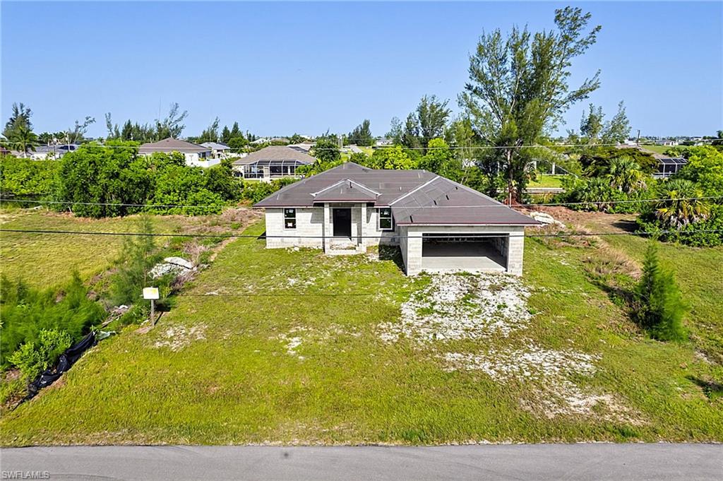 Outstanding opportunity to complete this unfinished new construction home situated on a freshwater canal in desirable NW Cape Coral. Currently designed to offer approximately 1,658 square feet of living space, the planned floor plan features 4 bedrooms, 2 bathrooms, and is positioned on a .23-acre waterfront homesite.

Construction has been started, providing a valuable head start for a builder, investor, contractor, or buyer looking to customize the finishes and create a beautiful waterfront residence. The thoughtfully planned layout offers the potential for comfortable everyday living while taking advantage of the peaceful freshwater canal setting.

Enjoy the benefits of Cape Coral's growing Northwest area with convenient access to shopping, dining, parks, schools, and recreational opportunities. Whether you're looking to build equity, add to your investment portfolio, or complete your future home, this property offers exceptional potential.

The property is being sold **as-is** in its current unfinished condition. Buyer will be responsible for completing construction and is encouraged to verify all permitting, inspections, and completion requirements with the appropriate local authorities.