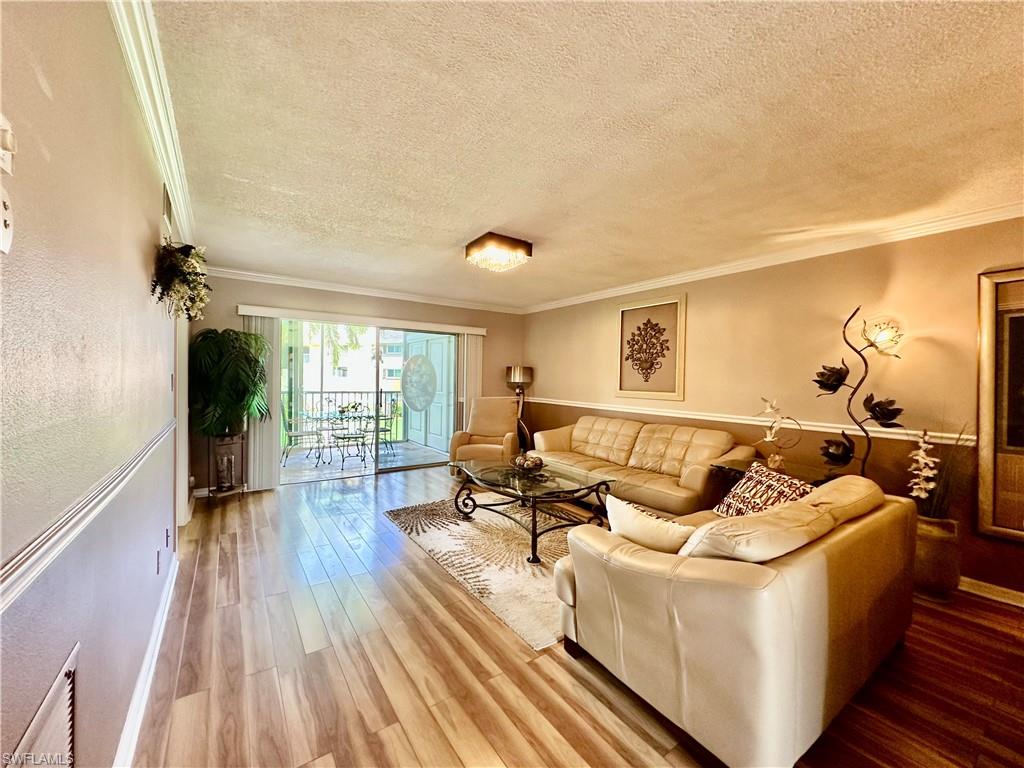 ANNUAL RENTAL in a desirable 55+ community! Welcome to this beautifully maintained, fully furnished 2-bedroom, 2-bath condo in the friendly Country Club Manor community. Move-in ready and thoughtfully decorated, this inviting home features granite countertops in the kitchen and bathrooms, stainless steel appliances, tile and laminate plank flooring throughout, and a bright, open living space designed for comfortable Florida living. The spacious bedrooms, in-unit washer and dryer (balcony), and covered carport provide everyday convenience. Relax on the screened lanai overlooking the community pool and beautifully landscaped grounds, the perfect spot to enjoy your morning coffee or unwind at the end of the day. Residents enjoy a heated community pool, BBQ grills, and a picnic area, creating a welcoming atmosphere for socializing and recreation. Conveniently located just off US-41, you'll be close to shopping, dining, medical facilities, and only a 12-minute drive to Naples' beautiful Gulf beaches. Clean, well cared for, and ready for immediate occupancy—don't miss this exceptional opportunity!  Renter's insurance will be required, No pets, Water, internet is included.