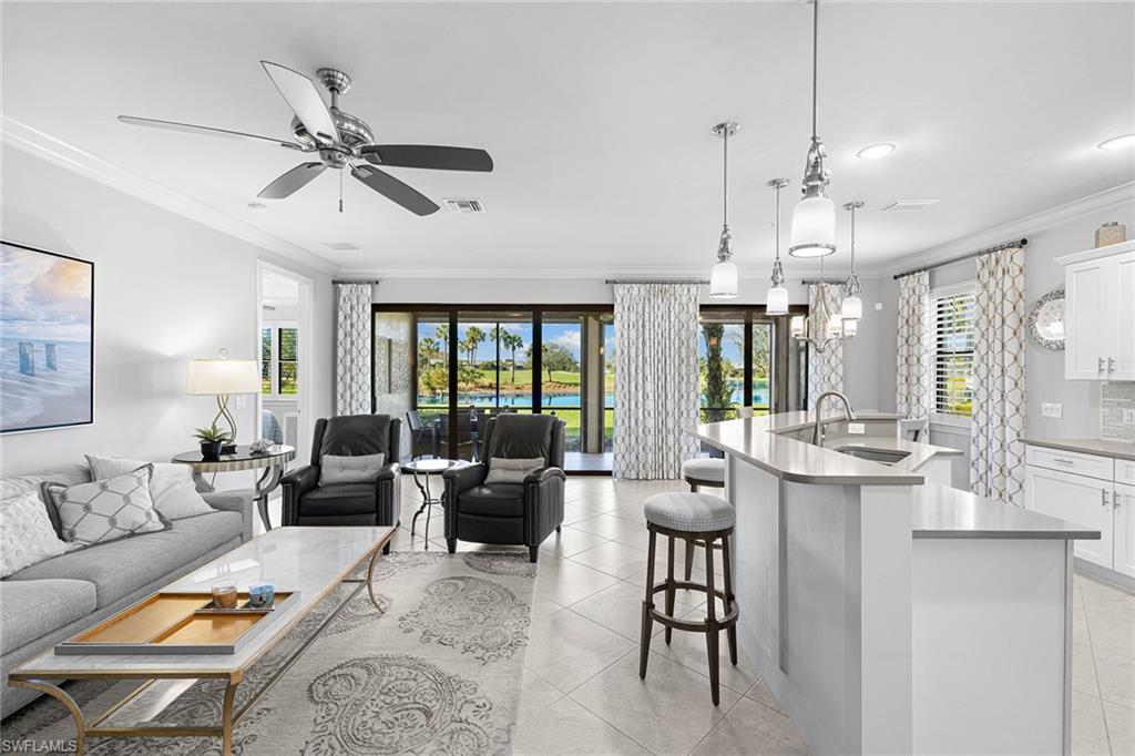 This gorgeously appointed coach home in The TwinEagles Club has full golf membership deeded to the property, offering you everything the club has to offer. The beauty of purchasing a full golf property in TwinEagles means no waiting list and golf privileges immediately upon closing. Features two bedrooms plus den that can serve as guest quarters, and two full baths. A light, bright coastal palette throughout the property makes you happy you chose the Florida lifestyle. The screened lanai offers beautiful daytime views and breathtaking sunsets. Along with the protection of impact windows and doors, the lanai is also outfitted with automatic storm screens. The club has recently undergone an extensive renovation to the clubhouse and many amenities. Enjoy 36 holes of some of Southwest Florida's best golf in one location. You will look forward to calling this ideally sized coach home your seasonal or year-round home.