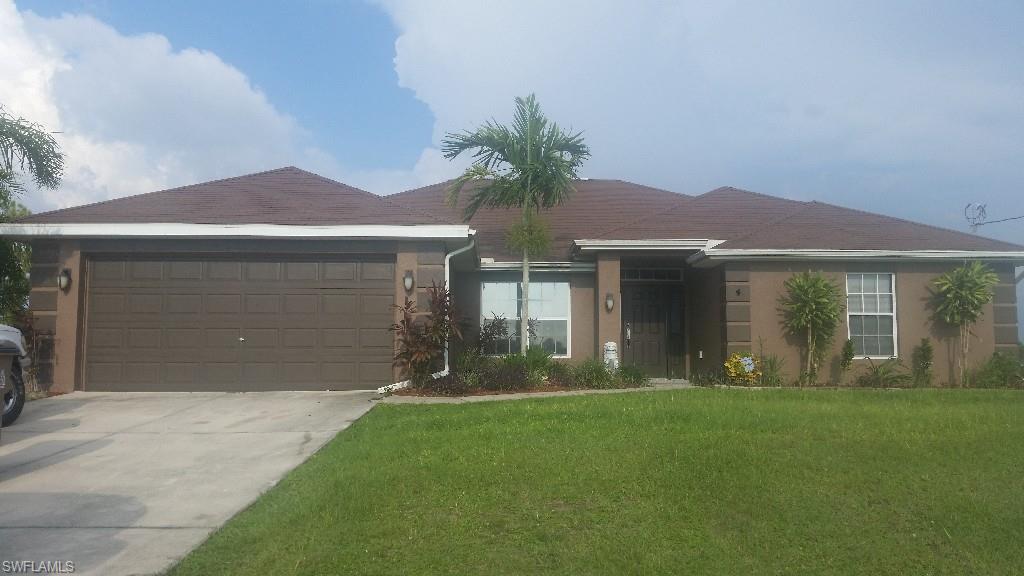 Beautiful home in quiet, safe neighborhood where neighbors are welcoming.
4 bedroom 3 full bath home with over 2100 square feet of living area. The kitchen has all new stainless steel appliances, cherry wood cabinets with a chocolate glazing and glass doors, built in oven and microwave, a cook top, double door refrigerator and duel stainless steel kitchen sink. 
There are also granite counter tops and tile floors in all the wet areas. The rest of the flooring is a hand scraped hard wood floor in the hall ways, 2 bedrooms and living room. The additional 2 bedrooms have carpet.

The master bath comes with a shower, garden tub, dual sinks and a deep walk in closet. 


 Brand new air conditioning unit was installed March 2015. Exterior house was painted June 2015.

All windows will come with wooden mini blinds as pictured. (Not curtains)
Buyer to assume future assessments for water and sewer - check with City of Cape Coral for current utility expansion schedule .