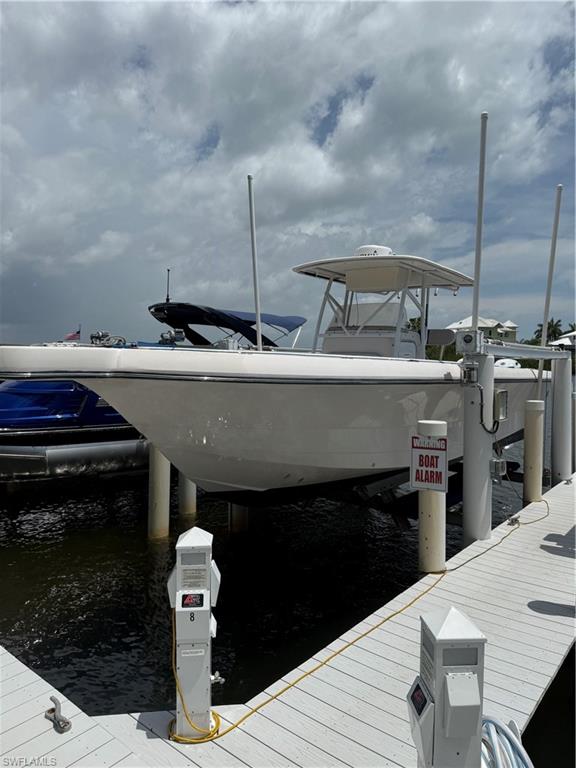 Barefoot Boat Club WS-8 is Perfect for Pontoons, Catamarans and Near Shore boats with max specs of 9k lbs. 30'L x 9'6"W. Least expensive boat slip with boat lift offering 24hr boat access. Marina is located just minutes to the wide open Gulf via Wiggins Pass or New Pass or take the intercoastal to Estero Bay North to Ft. Myers Beach, Sanibel and beyond. Members enjoy premium amenities, including a clubhouse with bayside pool, tiki hut, kitchen, restrooms and bags of ice and on site marine grade fuel. Service Racks are available for service and detailing.