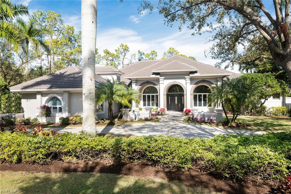 Enjoy expansive views overlooking the lake and green of the second hole of the Pine Course from this spectacular Estates home in Grey Oaks. Gorgeous maple floors throughout the main living areas lead to a newly renovated kitchen fit for the most sophisticated chef, featuring two Taj Mahal granite islands, beautiful cabinetry, top appliances and unique coffee bar. The attention to detail and thought put into this home are just incredible. Open to the family room with pocketing sliders to your enormous, newly refreshed pool with a covered lanai and summer kitchen. The spacious master bedroom with an adjacent den is on the first floor. All guest rooms are en suite with two conveniently located on the first floor and the third offering a private retreat on the second floor. Grey Oaks Country Club is Naples' only private club with 54 holes of golf. In addition, the club offers exclusive amenities including a 30,000-square-foot wellness center and spa, the resort-style lagoon pool, active tennis, pickle ball, and bocce programs, indoor and outdoor restaurants and much more. Located just minutes from Naples' gorgeous beaches and downtown shopping, dining and nightlife.