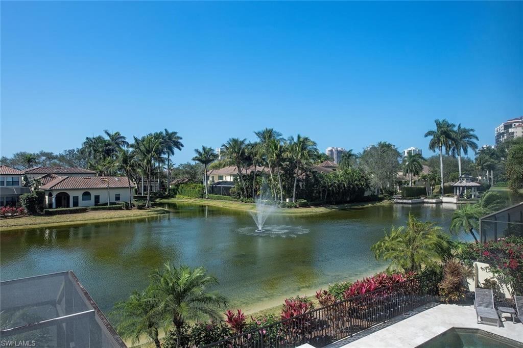 V4840 - A forever Valentine, Christmas, and Birthday Gift for all your loved ones. This charming, meticulously cared for joyful southern lake view Vizcaya 2-story JEWEL will warm your heart each & every day of your ownership. Capture this highly desirable 3 BR+Den or 4 BR, 3.5 Bath GEM sure to meet your family’s needs for many years. Relax as your ownership is carefree, due to this GEM’S significant menu of updated features, accomplished by long-time existing owners: stormproof impact windows, sliding glass doors, & electric hurricane shutters, 2021 heated pool/spa refinishing, 2021 exterior painting, 2018 tile roof + two 2021 A/C systems. Impressive interior showcases soaring ceilings, marble floors, custom cabinetry, clerestory transom windows, granite surfaces, soft-lit crown tray ceilings, plantation shutters, serving bar, Subzero, Miele, Bosch & GE Profile chef’s kitchen appliances + A/C garage. Add the exceptional “Sun-in-the-Fun” World Class Bay Colony & Pelican Bay included membership privileges for A MAJOR HOME RUN: 2½ miles of sugar sand beach, 3 Beachfront Dining & Tennis Clubs, attended Beachfront services, walking & bike paths, plus Fitness, Learning & Wellness Center.