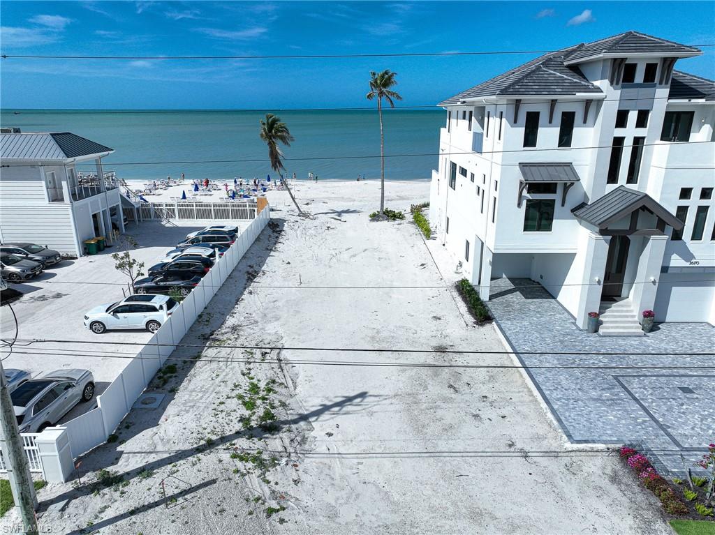 This direct Bonita Beachfront lot offers the ultimate building site for your next home or even two attached Villa homes and this lot is zoned C-1 (Commercial 1). The lot is much larger than the typical Bonita beach 50’ wide building site and will accommodate a much larger home or homes - .3667 acres and 50x307x51x310. But best of all the new building to the South is much lower than the typical building height and sits far away to the south - not the typical 10’ between homes. This will allow for fantastic southern and southwest exposure in addition to the typical west exposure resulting in fantastic views of the gulf both west and down the coastline, year round sunsets and natural light all day in your home and on your pool.  The lot sits next to a newer home to the north as well so no future construction to deal with. Finally, THIS LOT IS THE LOWEST PRICED DIRECT BEACHFRONT LOT ON BONITA BEACH and through Collier County/Naples. City of Bonita Springs Zoning Verification letter available for review and verification of permitted uses and a survey is also available