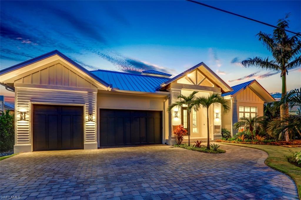 H. 16120 - Presenting the ultimate Naples retreat. A new construction home perfectly situated in desirable Royal Harbor with captivating views of intersecting canals and a sunset-loving western exposure, your coastal oasis awaits.  Go ahead...Unwind.  Appreciate the inviting foyer, enjoy the sun-splashed great room with it's soaring cupola, then step onto the spacious lanai where you'll spend hours relaxing. Wide water views with a sense of privacy enhance your experience.  You'll find endless custom upgrades throughout this home including wide plank wood floors, a luxurious chef's kitchen boasting a 48" Viking range, ice maker & pot-filler, two fireplaces, wine bar, outdoor kitchen, 5-zone Sonos audio system, stunning decorator upgraded finishes, and custom auto blinds.  A 20,000 lb. boat lift, floating dock, electric screens & shutters on the lanai, whole house generator with 1000-gallon propane tank, impact windows & doors, standing seam metal roof and new seawall complete your sanctuary...This is truly an amazing opportunity...Move in today.