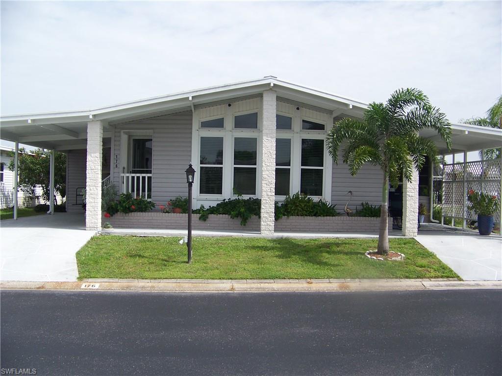 LOOK NO FURTHER! GORGEOUS CURB APPEAL! Beautiful, GATED Burnt Store Colony, the community with lots of amenities & the FRIENDLIEST PEOPLE welcoming you & your fur babies! Spacious, updated, corner lot, 3 bed, 3 bath home offers land share($32K value), many updates & extras so as you enter, you'll fall in love! Ext. has 2 stamped covered driveways, all weather lanai(10 x 23.5), lg. shed & concrete curbed gardens. Int. is stunning! You will be amazed at the enormous great room, cathedrals & array of ceiling to floor windows, & porthole! Dining overlooks HUGE kitchen offering granite EVERYWHERE, dbl. crown & tile backsplash! The center island (3.5 x 7.5) has 10 drawers. Fully applianced, undermount sink w/window & MORE! There's a family room,  laundry room, 2 guest rooms & large Master with vaulted ceiling. All 3 baths have granite w/showers &/or tubs. Updates/extras: Membrane roof over 2019, Luxury vinyl plank floors, carport tie downs 2021, moisture barrier, A/C comp/ductwork 2019, int. paint/drywall, windows, brushed nickel & s/s hardware, all faucets & disposal, wanes coating, replumbed w/PEX & maniblock, clear hurricane panels/solid skirting, gutters/downspouts! Come take a look!