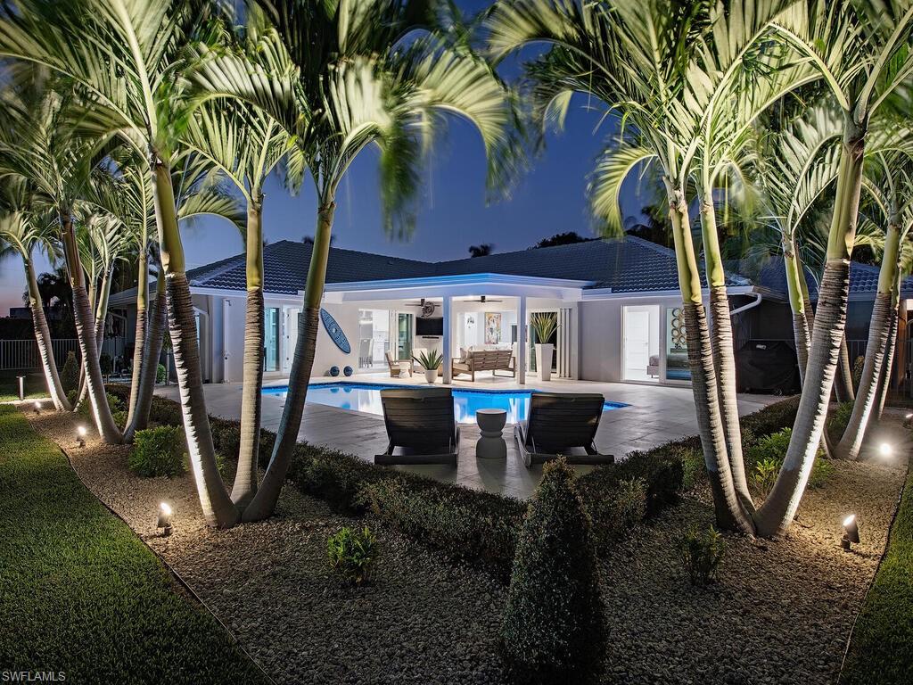 Spectacular, completely renovated property on the widest and deepest canals in Royal Harbor! Ideally situated on .42 acres with just under 150 feet on the water providing fast, direct Gulf access with no bridges. No detail was overlooked showcasing modern design and decor throughout, high-end finishes and an open floor plan that flows seamlessly from the interior to exterior living spaces. This desirable residence is an entertainers dream featuring a huge island with gorgeous, quartz countertops, Wolf and Subzero appliances, oversized laundry room with second refrigerator, large bedrooms and multiple dining areas. Home is finished with a whole house generator, impact doors and windows, three car garage and a large fenced backyard with a large inviting pool. Boating has never been easier with 20,000 lb boat lift, 6,000 lb lift for 2 JetSkis and floating dock. Conveniently located just minutes to downtown Naples 3rd St., South and 5th Ave., South's fine dining, world class shopping, entertainment, and Naples' famous white sand beaches!