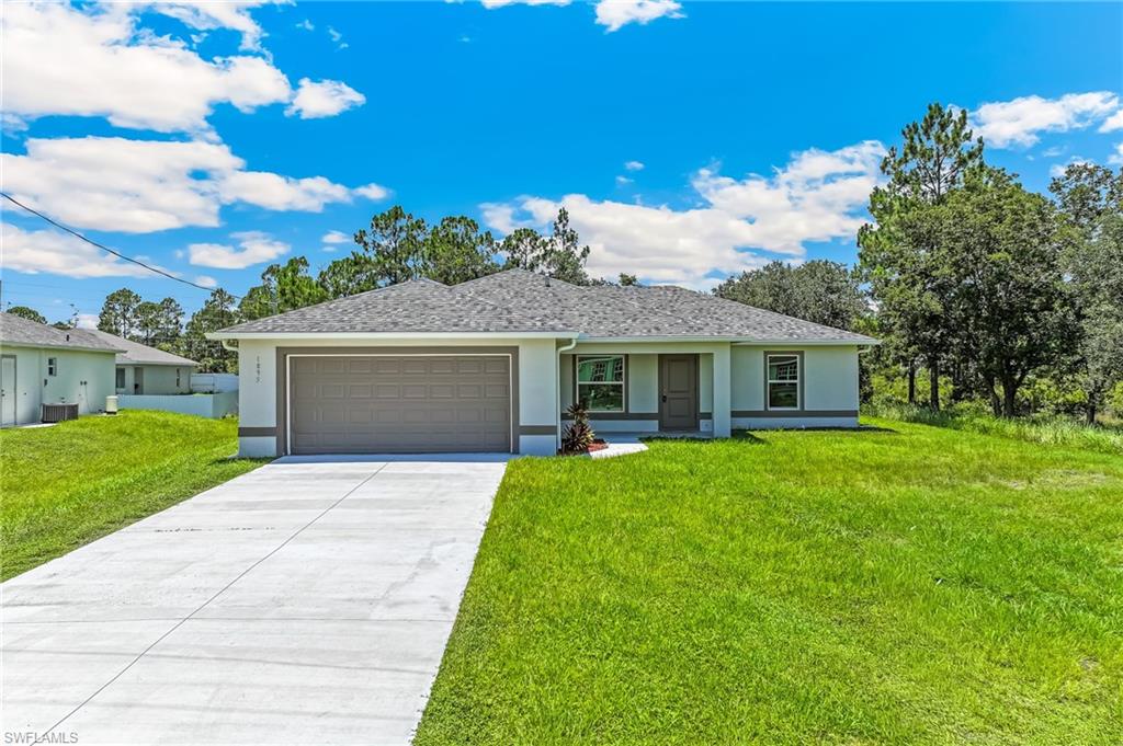 Experience the exceptional quality of this brand-new construction home featuring 3 bedrooms, 2 bathrooms, and a 2-car garage, perfectly situated on an oversized lot with western exposure—ideal for enjoying Florida's spectacular sunsets. Located in the desirable Greenbriar neighborhood of Lehigh Acres, this move-in-ready home offers 1,503 square feet of air-conditioned living space, and is ready for its new owners today.

The beautifully designed island kitchen showcases quartz countertops, stainless steel appliances, a glass tile backsplash, real wood soft-close shaker cabinetry, stylish pendant lighting, and a spacious walk-in pantry—making it both functional and inviting.

Thoughtfully upgraded throughout, this home features hurricane-impact windows and doors, oversized white porcelain tile flooring, soaring ceilings, a spacious living room, and a dining area with picturesque views. Hurricane-impact sliding glass doors lead to the outdoor living space, while custom two-tone interior and exterior paint, ceiling fans, and generous walk-in closets enhance comfort and style.

The private owner's suite offers a luxurious bathroom with quartz countertops, a custom-tiled walk-in shower with glass enclosure, and ample closet space. The guest bathroom is equally well-appointed with quartz countertops and a custom-tiled shower.

Additional highlights include a large laundry room complete with a brand-new washer and dryer, an oversized two-car garage with a durable epoxy-coated floor, a spacious concrete lanai perfect for entertaining and outdoor barbecues, and a builder's home warranty for added peace of mind.

Conveniently located near regional shopping, restaurants, schools, parks, golf courses, boat ramps, major league baseball spring training facilities, Florida Gulf Coast University, Southwest Florida International Airport, Interstate 75, world-class sport fishing, and the stunning white-sand Gulf beaches, this home offers the perfect blend of quality, comfort, and location.

Schedule your private showing today and discover everything this exceptional new home has to offer!