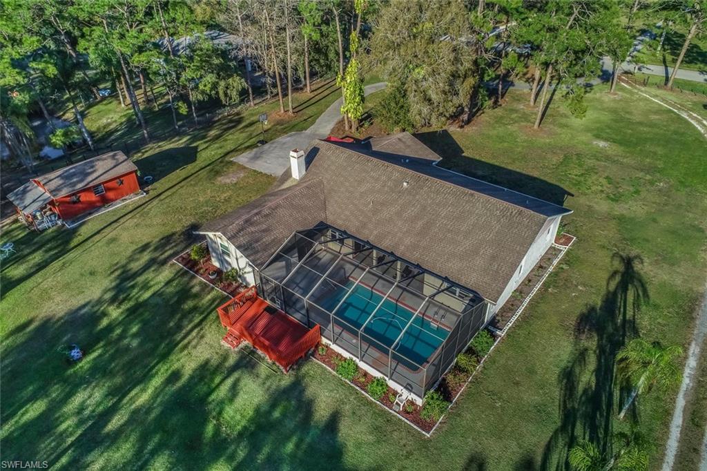 Gorgeous Pool Home with Guest House on over 2 Acres in Buckingham! Peaceful surroundings and mature trees greet you as you drive up to this beautiful estate. This home has 3 bedroom and 2 baths in the main house and over 2000 sq.ft of living space. The recently updated kitchen features stainless steel appliances and granite counters. Both bathrooms have been updated and feature custom tile and vanities. You will enjoy the vaulted ceilings, tile flooring throughout, HUGE master suite with walk in closet, stone fireplace in the living room and the spacious pool area. Sip your morning coffee and enjoy the peace and quiet off the deck that looks over the groomed landscape. Your guests will never want to leave their private guest house that has 1 bedroom, great room with equipped kitchen, and full bathroom. The 30x40 Barn has two large garage doors, concrete floor, water, electric and is perfect for all your storage needs. Property is zoned Ag-2 and is great for the animal enthusiast. This house has everything you need and the outdoor space you have always wanted! Close to I-75, shopping, restaurants, churches and schools.