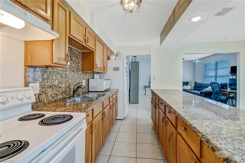 Delightful three bedroom two bathroom single family residence ideally located with no HOA!  Prepare to be greeted into your new home by a spacious entry into the family dining area, equipped with granite counter tops, electric range and stainless steel appliances. Access the screened in lanai from three different points; front entry, kitchen and backyard entry. Tile flooring throughout allows for an even flow into all rooms and bathrooms that feature marble countertops. Need to restock on fruit? No need to make a trip out to the store! Take a quick walk through the backyard to find a mature mango tree and pick to your heart’s desire. Your screened-in lanai is then only a few steps away for you to sit down and indulge. Just minutes from downtown Naples.