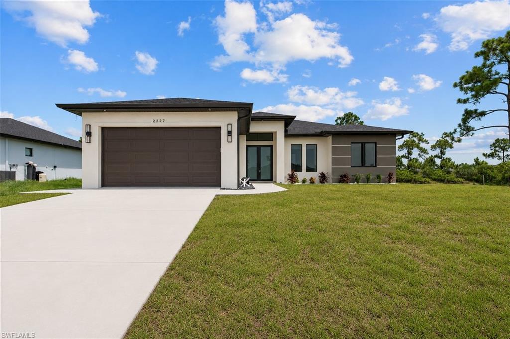 Experience modern elegance in this newly built custom residence, thoughtfully designed with premium finishes, soaring ceilings, and seamless indoor-outdoor living.
From the moment you arrive, the striking contemporary exterior, oversized driveway, and clean architectural lines create exceptional curb appeal. Inside, you'll be welcomed by an expansive open-concept floor plan featuring glossy porcelain tiles throughout, tray ceilings, designer lighting, oversized ceiling fans, a unique and elegant wall mount wine rack, and abundant natural light.
The chef-inspired kitchen is the heart of the home, showcasing custom soft-close cabinetry, granite countertops, a full-height stone backsplash, stainless steel appliances, wall oven and microwave, a sleek vent hood, and generous workspace perfect for entertaining.
The spacious great room flows effortlessly into the dining area and out to the covered lanai through oversized glass doors, creating the ideal setting for gatherings with family and friends.
The home's modern design continues throughout with spacious bedrooms, custom closets, premium fixtures, and a clean contemporary aesthetic.
Step outside to your private outdoor retreat featuring a fully equipped summer kitchen with sink, refrigerator, and ample prep space. The expansive covered patio overlooks a peaceful freshwater canal, providing a tranquil backdrop for morning coffee or evening sunsets.
Ideally located in one of Cape Coral's fastest-growing areas, this exceptional home is just minutes from the highly anticipated Star Farms Development and the transformative Seven Island Project. With quality craftsmanship, desirable upgrades, and a location poised for continued growth, this home offers an outstanding opportunity to enjoy the Southwest Florida lifestyle. 
NOT in a flood zone! Schedule your private showing today!