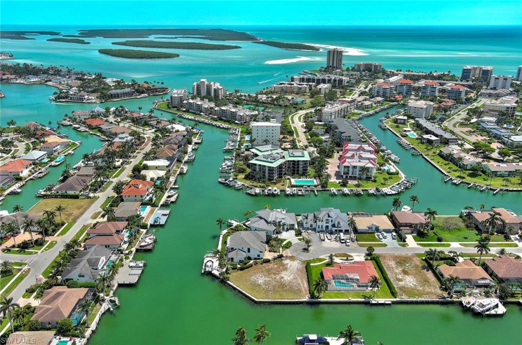 Unmatched Waterfront Opportunity on Marco Island!
Located at the end of a coveted finger canal, this premier parcel offers a larger lot with an extraordinary 160 feet of water frontage with expansive intersecting canal views. A rare find, this cleared and ready-to-build lot provides direct Gulf access with no bridges, deep water, and a generous seawall—perfect for accommodating large yachts or custom docks, boat lifts or whatever toy you would like!

Surrounded by upscale residences and within walking distance to Marco Island Beach, movie theaters, fine dining, and boutique shopping, this location delivers the ultimate island lifestyle. It’s perfect for retirement and for fun! It’s Positioned at the gateway to the 10,000 Islands, it’s ideal for boating enthusiasts, avid anglers, or those who simply crave adventure and tranquility.

Whether you’re looking to build a luxury residence, an elite vacation rental, or a private waterfront retreat, this property offers endless potential in a top-tier location.