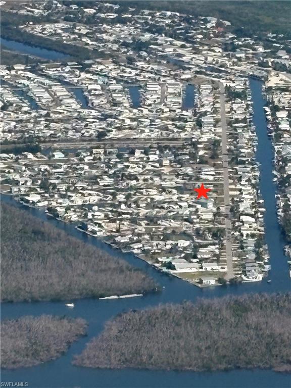 Exceptional Triple Lot Waterfront Opportunity in St. James City.
Discover an incredible opportunity to own a rare triple lot (0.30 acres) in one of Southwest Florida’s most desirable coastal communities. Perfectly positioned on the corner of York Road and Coconut Drive, this cleared property is ready for your vision—whether you’re looking to build your dream waterfront home or develop up to three separate residences.
This property is already equipped with essential improvements, including Pine Island water, electric, septic, a concrete seawall, and a dock with a 10,000 lb boat lift—making it truly build-ready and ideal for boating enthusiasts.
You can generally build a traditional, site-built "regular" house (single-family dwelling) on property zoned MH-1 in Lee County, FL. MH-1 permits single-family homes in addition to manufactured housing. However, you must meet all Lee County Building Code standards.
For those seeking even greater potential, two adjacent waterfront lots along York Road are also currently available. Combined, these properties could offer approximately 200 feet of waterfront and over half an acre of prime coastal living—perfect for a private estate or multi-home development opportunity.
Enjoy direct access to some of the best fishing in Florida just minutes from your dock, with abundant catches like grouper, redfish, trout, and tarpon. Conveniently located near local restaurants, shopping, and golf, this property offers the perfect blend of tranquility and accessibility.
Don’t miss your chance to capitalize on the exceptional flexibility and waterfront lifestyle this unique property provides.