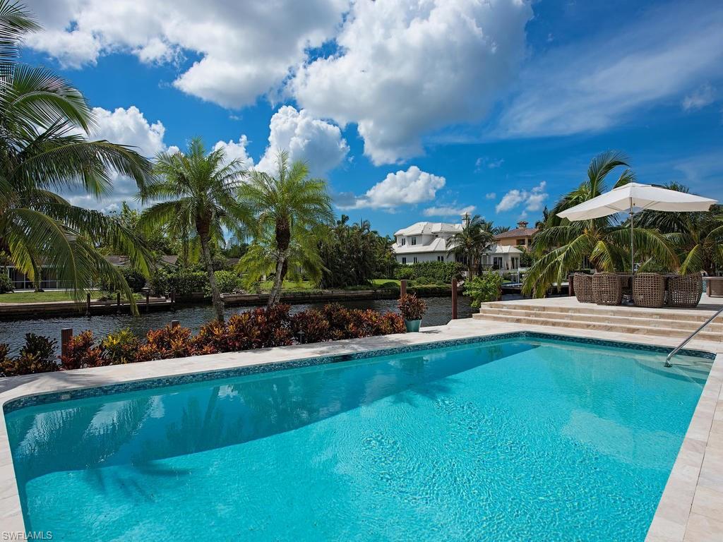 Luxury at its finest with 182 feet of water frontage!  This completely renovated 4 bedroom plus den home is appointed in elegance and design in every room.  Property features new hurricane rated windows and doors throughout, African Santos Mahogany floors, granite countertops with Wolf gas range.  Just a few short blocks to Naples beautiful beaches, high end shops of 3rd Street, and Naples best dining.  Breathtaking sunset views to the West and Naples Bay to the East.  A unique find in the heart of Naples.  Call today for your private showing.