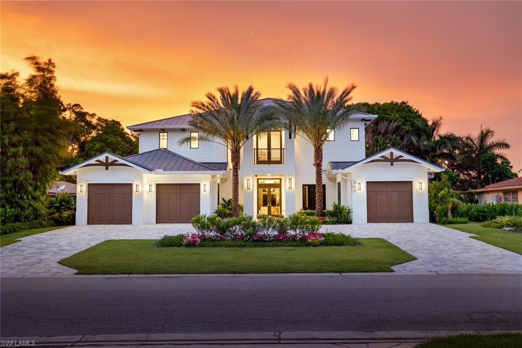 Walking distance to beach access and the upscale Waterside shops and restaurants. Not in a flood zone, this brand-new custom home built in Park Shore with preserve views offers the perfect blend of luxurious finishes and modern low maintenance design.
The open-concept architectural plan features four spacious en-suite bedrooms, a study, four full bathrooms, two half bathrooms plus an upstairs loft with a morning bar, perfect for welcoming guests. The gourmet kitchen features fully mitered Cristallo quartzite countertops, double islands with matching sinks, a walk-in pantry, SubZero and Wolf appliances including a steam oven. There’s a private elevator to the upper level, where a serene sun deck overlooks the beautifully mature landscape. There are no stairs to climb to get in the house thanks to the high natural elevation. Complete with a whole home generator and a saltwater pool and spa, summer kitchen, and covered outdoor living space for year-round enjoyment. The main-level primary suite offers a luxurious retreat with a spa-like bathroom and dual walk-in closets. Smart home automation powered by Josh.ai allows for intuitive voice or mobile control of lighting, climate, audio, and security throughout the home.
With close proximity to Venetian Village, Waterside Shops, and Park Shore’s private beach park, this is a rare opportunity to own one of Naples’ most desirable locations.